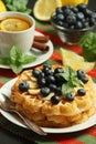 Belgian waffles with blueberry and a cup of tea with lemon Royalty Free Stock Photo