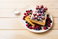 Belgian waffles with blueberry, raspberry and ising sugar Royalty Free Stock Photo