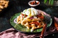 Belgian waffles with egg, arugula, tomatoes and dried meat. Savory waffles. Breakfast concept. poached egg. Sun-dried Royalty Free Stock Photo