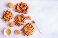 Belgian waffles with fresh peach and honey on white background top view flat lay Royalty Free Stock Photo