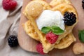 Belgian waffles with fresh raspberries and honey syrup