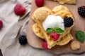 Belgian waffles with fresh raspberries and honey syrup