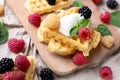 Belgian waffles with fresh raspberries and honey syrup