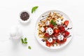 Belgian waffles with fresh strawberry, chocolate topping and whipped cream Royalty Free Stock Photo