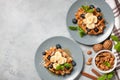 Belgian waffles with honey, banana, nuts and blueberries