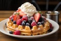 Belgian waffles with ice cream and fresh berries on wooden table, A crisp, golden Belgian waffle topped with fresh berries and Royalty Free Stock Photo