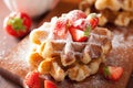 Belgian waffles with icing sugar and strawberry Royalty Free Stock Photo