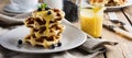 Belgian waffles with lemon Kurd and blueberries. Rustic style. Selective focus Royalty Free Stock Photo