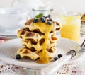 Belgian waffles with lemon Kurd and blueberries. Rustic style. Selective focus