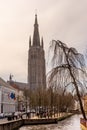 Belgium, Bruges, Brugge, a canal with church of our lady in the background Royalty Free Stock Photo