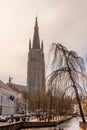 Belgium, Bruges, Brugge, a canal with church of our lady in the background Royalty Free Stock Photo