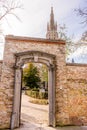 Belgium, Bruges, a open door in front of a brick building with churh of lady in background