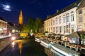 Belgium, Brugge, night cityscape, church and river