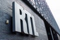 Belgium, Brussels, Facade of the RTL House with the RTL logo at the entrance of the building