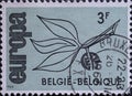 BELGIUM - CIRCA 1965: A postage stamp from Belgium showing a branch with fruit formed from the letters CEPT Text: Europe Royalty Free Stock Photo