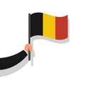 Belgium flag in hand. Hand holding national flag of Belgium.