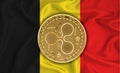 Belgium flag, ripple gold coin on flag background. The concept of blockchain, bitcoin, currency decentralization in the country.