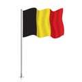 Belgium flag waving on a metallic pole.