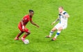 Belgium national football team striker Michy Batshuayi against Finland midfielder Joni Kauko during EURO 2020 match Finland vs Royalty Free Stock Photo