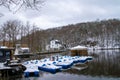 Belgium, Spa, View of Lake Warfaaz under the snow with its pedal boats