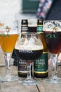 Belgium Straffe Hendrik beers bottles and Brugse Zot beer glasses Royalty Free Stock Photo