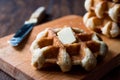 Belgium Waffle with Butter on wooden surface. Royalty Free Stock Photo