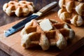 Belgium Waffle with Butter on wooden surface. Royalty Free Stock Photo