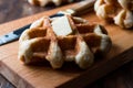 Belgium Waffle with Butter on wooden surface. Royalty Free Stock Photo