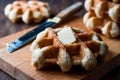 Belgium Waffle with Butter on wooden surface. Royalty Free Stock Photo