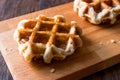 Belgium Waffle with Maple Syrup on wooden surface. Royalty Free Stock Photo