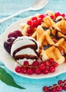 Belgium waffles with chocolate sauce, ice cream and berries Royalty Free Stock Photo