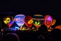 Annual festive night glow of balloons near oak forest