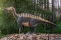 Full-size iguanodon statue in the forest of Belgorod dinopark. Side view Royalty Free Stock Photo