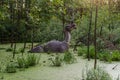 Full-size iguanodon statue in the swamp of Belgorod dinopark Royalty Free Stock Photo