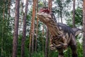 Full-size statue of allosaurus in the forest. Dinopark of Belgorod city