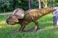 Full-size statue of protoceratops in the forest of Belgorod dinopark. Herbivore dinosaur