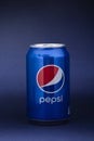 Belgorod , Russia - MAY, 17, 2020: Pepsi drink in a can on ice isolated on blue background. Carbonated soft drink produced by