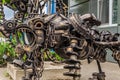 Street metal sculpture of a robot dog made of old cars parts and details, auto-waste. Royalty Free Stock Photo