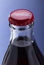 Belgorod , Russia - MAY, 28, 2020: top view of red cap from the glass bottle of Coca-Cola. Classic Bottle Top. Popular Carbonated Royalty Free Stock Photo