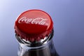 Belgorod , Russia - MAY, 28, 2020: top view of red cap from the glass bottle of Coca-Cola. Classic Bottle Top. Popular Carbonated Royalty Free Stock Photo