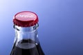 Belgorod , Russia - MAY, 28, 2020: top view of red cap from the glass bottle of Coca-Cola. Classic Bottle Top. Popular Carbonated Royalty Free Stock Photo