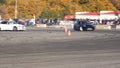 A drift racing car in action with smoking tires in show