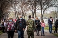 Selective blur on Old senior man and woman, couple, wearing a facemask, waking in street of Belgrade in spring during  coronavirus Royalty Free Stock Photo