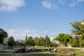 People sitting on Andricev Venac square in front of the Dome of the Narodna Skupstina, the seat of the National Assembly of Serbia Royalty Free Stock Photo