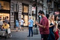 Indian tourist, young man from india, shooting, filming & taking photos with smartphone in a belgrade street while travelling