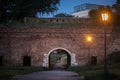 Two men walking at night in the Vidin kapija gate t night. Royalty Free Stock Photo