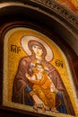 Belgrade, Serbia - December 20, 2022: Mary the Mother of God with her son Jesus Christ fresco in mozaic in orthodox teple Royalty Free Stock Photo