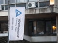 TUV Rheinland logo in front of their office certifying norm ISO 9001 2015.