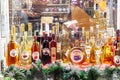 BELGRADE, SERBIA - DECEMBER 18, 2023: Various bottles of rakija, of different fruits sizes and flavours, on display in a market in