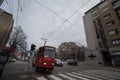 belgrade tram, a tatra KT4, from the line linija 2 passing by a street with cars driving.